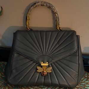 Elegant Gray Handbag with Gold Bee Accent